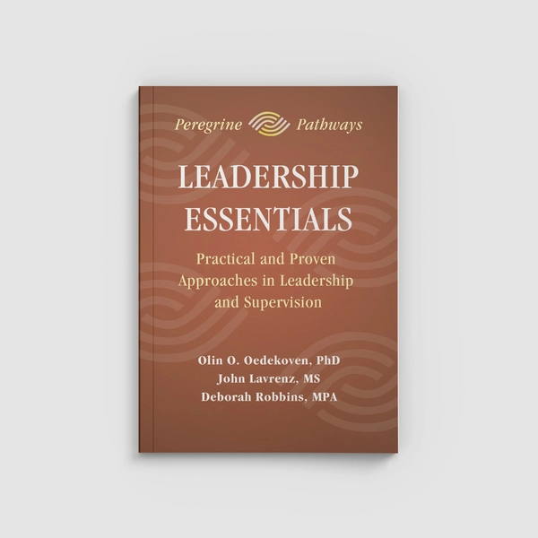 A brown/copper book title Leadership Essentials on a white surface