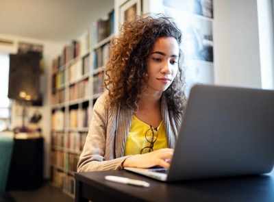 A woman sitting at her computer