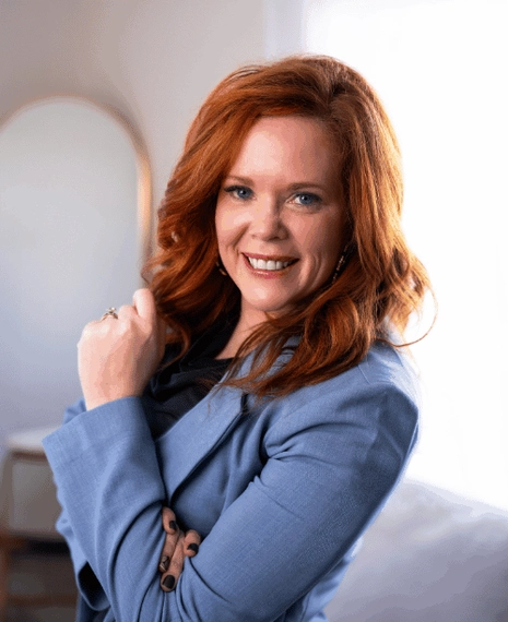 An image of Kayla Vos. She's wearing a blazer.