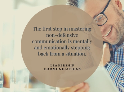 A man looking at a piece of paper while talking on the phone with messaging about leadership communications overlayed on the image.