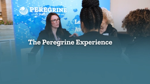 three women standing around a table with The Peregrine Experience written through the middle